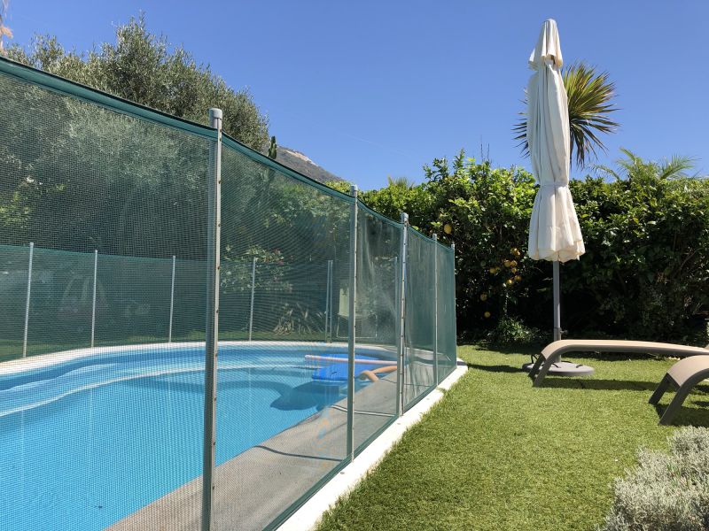 Removable Mesh Pool Fence in Use
